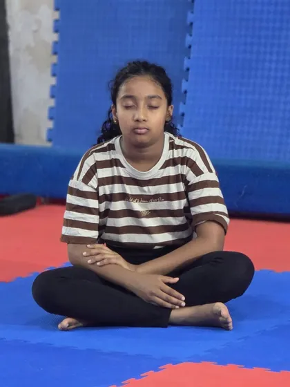 Finding stillness amidst the activity. We encourage our students to practice mindfulness to enhance their focus and body awareness during their gymnastics sessions.