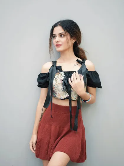 A candid-style pose from the same set, offering a different feel.