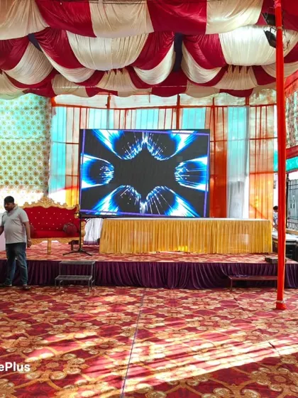 The stage within the pandal, featuring a large LED screen. I can arrange for LED walls for displaying visuals or live feeds during your event.