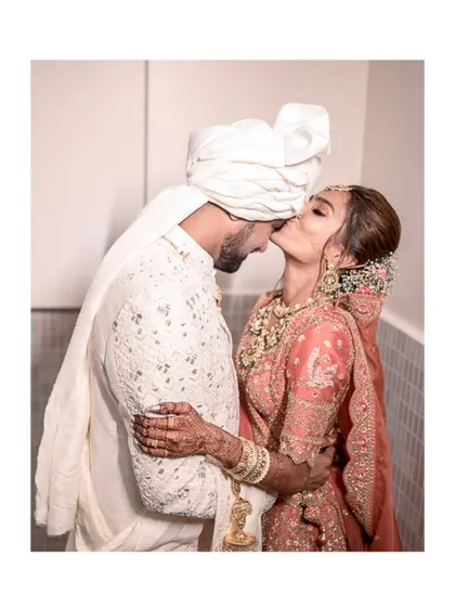 A kiss that seals the promise. This intimate moment, captured right after the ceremony, is full of love, relief, and the excitement of what's to come.