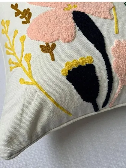 A close-up detail shot of the floral embroidery, showcasing the quality of the stitching and the texture of the fabric.