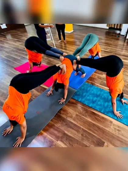 More fun with group yoga formations! These images capture the playful spirit and strong bonds forged in our training programs. It's all about connection and support.