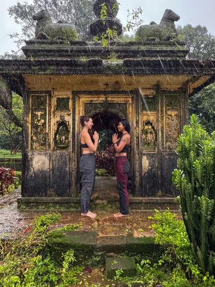 Filling our souls with gratitude and peace in the rain at a beautiful old temple. Sharing a 'Namaste' with a friend in such a serene setting is a reminder of the connections we build on these journeys.