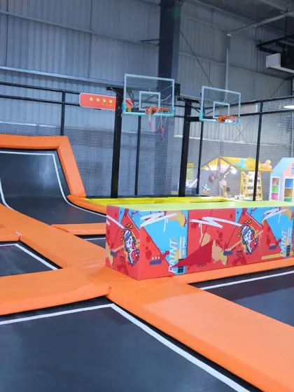 A wider view of our trampoline basketball setup, showing the dual hoops that allow for friendly competition and group play.