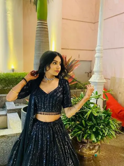 Another angle of this versatile black rental lehenga, perfect for any evening celebration.