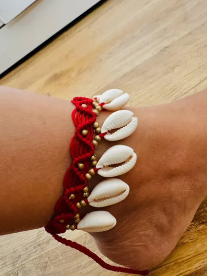 A close up view of the shell anklet. You can see the intricate knotting and the small gold beads I add between the shells.