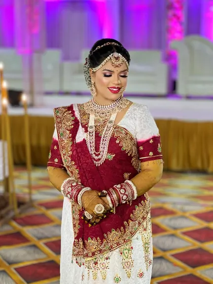 A beautiful shot of the bride on her wedding day, with the venue's lighting making her jewellery sparkle.