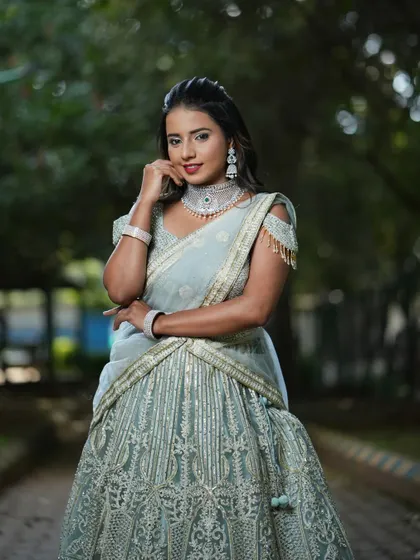 The intricate silver embroidery on this grey lehenga adds a touch of modern glamour to a traditional silhouette.