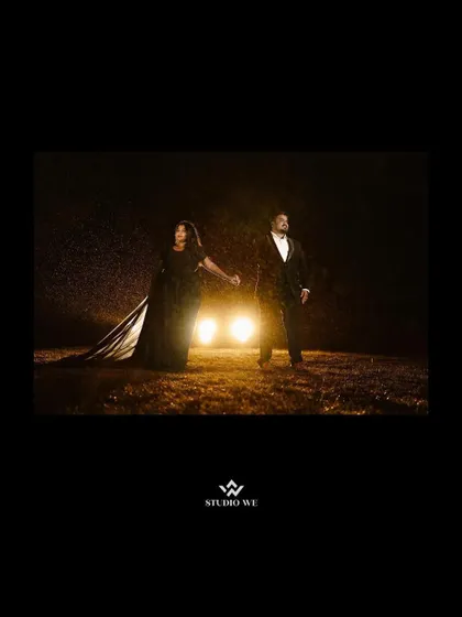 Another powerful shot from the rainy night shoot. The car headlights create a dramatic, cinematic atmosphere for this couple's portrait.