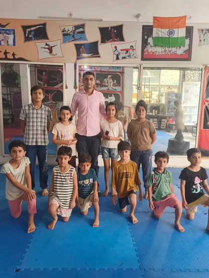 Another group photo, showing the mix of boys and girls who train together at the Gurukul.