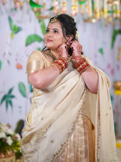 Our client Swetha, getting ready for her engagement in a custom golden pure silk tissue lehenga.