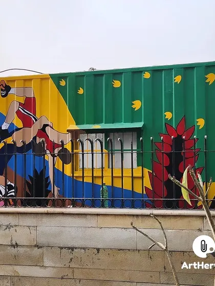 A dynamic sports-themed mural on another side of the shipping container. This project shows our versatility in painting a wide range of subjects in a consistent, colorful style.