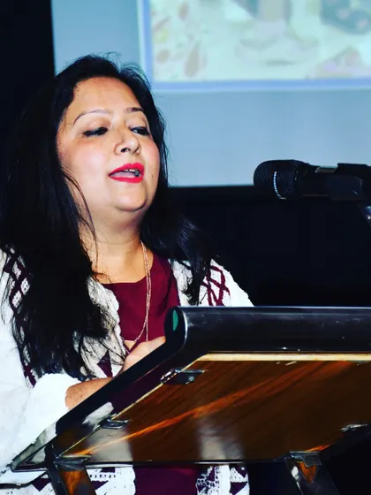 Our host, Bhumika Badani, eloquently guides the audience through the evening's performances and ceremonies during our 4th Annual Day.