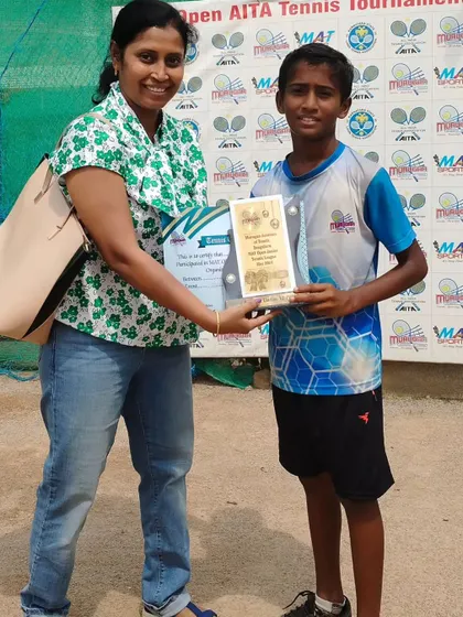 Kishan, winner of the Boys Under 12 tournament. This victory is a stepping stone to greater success in his tennis career.