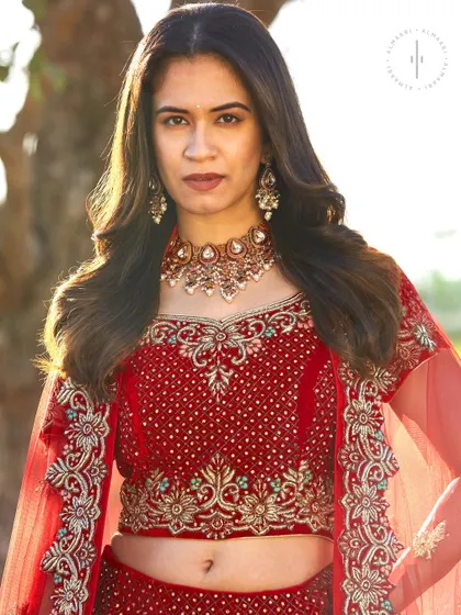 The blouse detail of this rental bridal lehenga features beautiful zardozi and stonework, paired with a matching choker necklace from my accessories collection to complete the look.