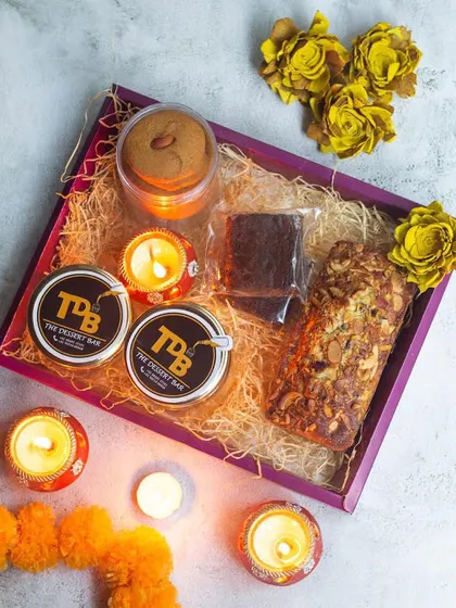 Inside the 'Bliss' hamper, you'll find dessert jars, a teacake, brownies, and even vegan and gluten-free ladoos. It’s a curated selection of sweet and savoury goodies for the festive season.