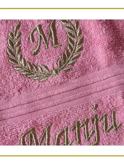 A personalized pink towel with an embroidered name and monogram, a thoughtful and useful birthday gift.