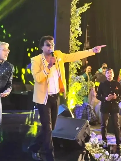 Pointing to a guest to join in the fun. Interactive moments like these are what make my wedding shows feel like a personal concert for the family.