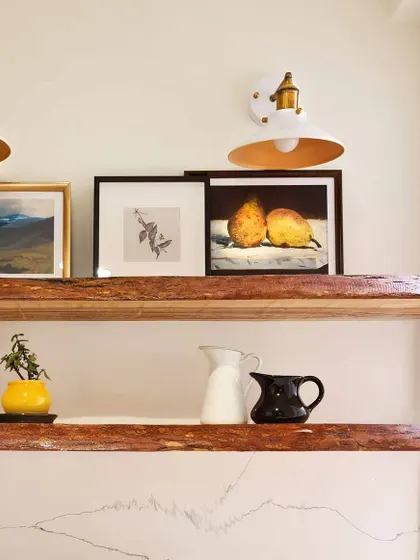 Details in unexpected spaces. For the utility area in the Breeze Home, I added these live-edge wood shelves to bring in a natural, rustic element and provide a beautiful spot to display art and other objects.
