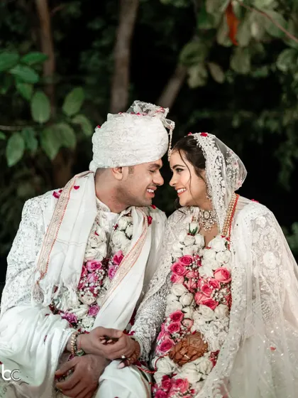 An intimate close-up of the couple, sharing a look of pure love and happiness after their wedding ceremony.