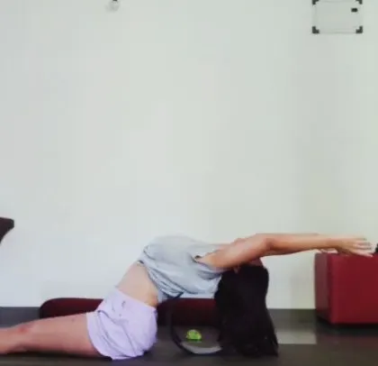 A supported backbend using a bolster. This is a restorative fish pose variation that gently opens the chest and shoulders, perfect for a day when my body is asking for less intensity.