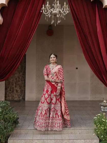 A timeless Gujarati bride. I styled her hair in a classic updo to go with her traditional gharchoda and red lehenga.