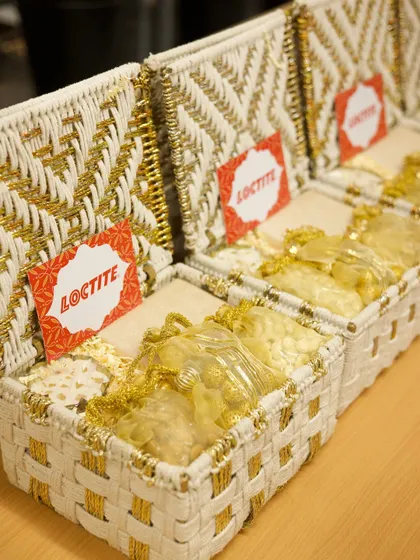 A closer look inside the Loctite Diwali boxes. We ensure every item, like these golden potlis of dry fruits, is neatly arranged to create a perfect unboxing experience.
