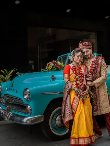 A romantic pose with the vintage car, this shot has a classic, timeless feel, perfect for a framed wedding portrait.
