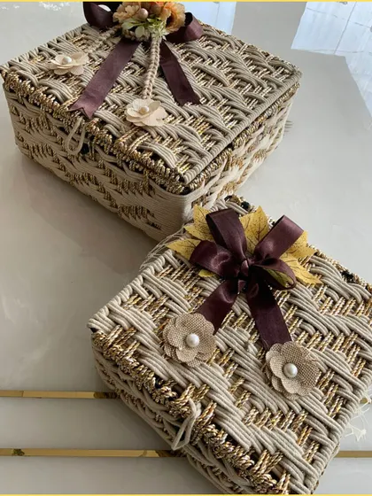 A shot of two beige jute hampers, showcasing their consistent quality and handcrafted appeal. These are perfect for creating a cohesive look for bulk orders.