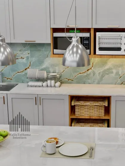 A close-up of the kitchen island and sink area, highlighting the beautiful marble-patterned countertop and the practical dish rack.