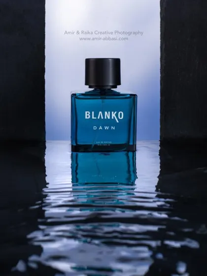 To capture the essence of a fragrance named "Dawn," we created a set with water and reflective surfaces. The cool blue tones and crisp reflections give the product a fresh, clean, and invigorating character.