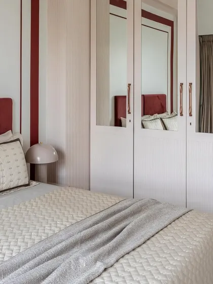 This series showcases different serene bedroom styles. From the bold red headboard with mirrored wardrobes to the calming green Murphy bed, each space is a sanctuary of calming colors and soft textures.