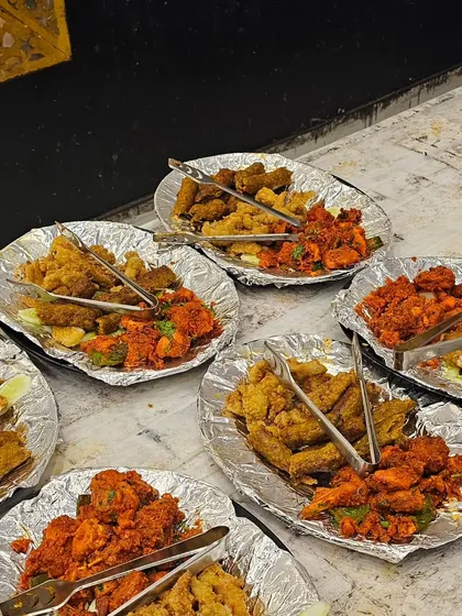 A variety of starter platters ready to be served at a wedding. We offer different combinations of fried and grilled items to ensure there's something for every guest.