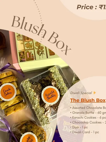 An informational graphic for the 'Blush Box' hamper, detailing the contents which include an assorted chocolate box, granola, Karachi cookies, and choco-chip cookies.