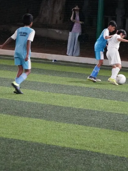 A one-on-one battle for the ball, highlighting the determination and fight of our players.