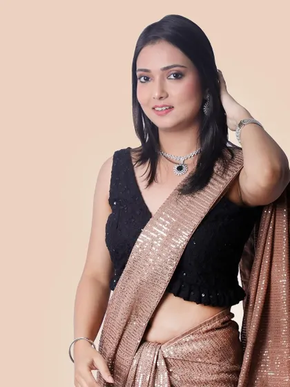 A smiling portrait of a model in a saree, creating a warm and approachable look for a brand's lifestyle or social media content.