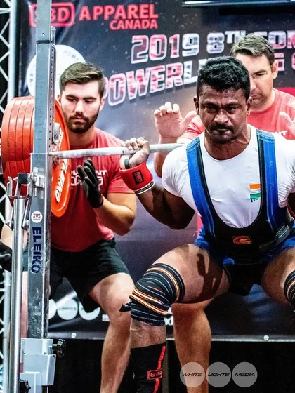 Focused and ready under the bar at the 2019 Commonwealth Championships in Canada. Experience on the international stage is invaluable, and I pass that knowledge on to my lifters.