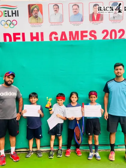 Our young tennis players and their coaches celebrating their wins at the DLTA Mini Tennis Open Tournament. This picture captures the supportive community we build at Rack4Pro.