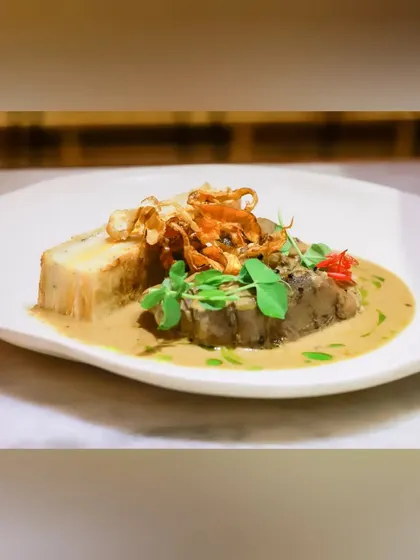 This seven-hour slow-cooked leg of lamb is a true labor of love. It melts in your mouth and is served with root vegetable dauphinois and a unique wasabi jus for a delightful kick.