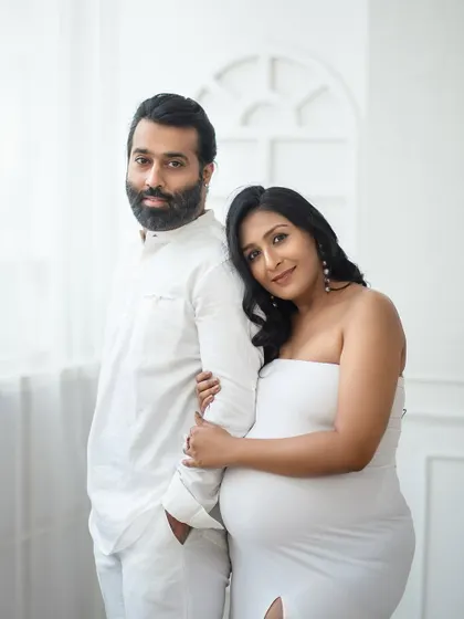 A serene and classic portrait in all-white. The simplicity of the styling and the soft natural light create a truly timeless and elegant image.