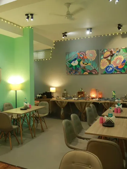 Can you feel the warmth like I do? Our cafe area is decorated with fairy lights and art to create a cozy and inviting atmosphere for all our guests.