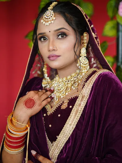Another angle of the stunning Punjabi bride, showing the harmony between the makeup and the intricate embroidery of her dupatta.