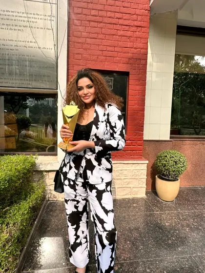 Holding the 'Noble Icon Award'. When you work hard, you grow. I am incredibly proud to receive this honor, which recognizes my dedication to the legal profession.