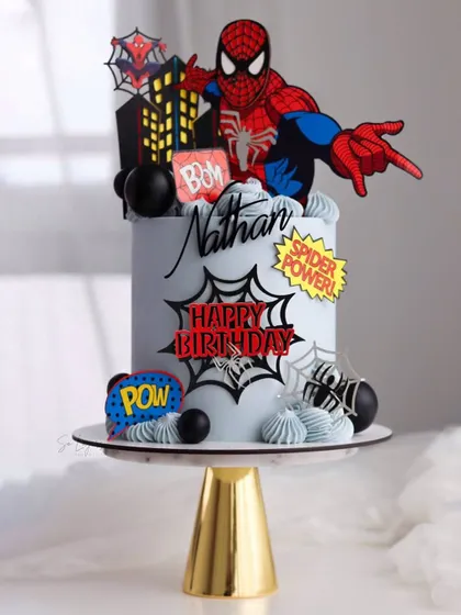 Your friendly neighborhood Spider-Man! This cake is action packed with comic book style "POW!" and "BOOM!" toppers, a city skyline, and a dynamic Spidey figure. Perfect for a superhero birthday party.