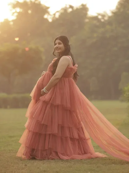 The golden hour light hitting the trail of the gown is just magical. This is why our trail gowns are such a popular rental for photoshoots.