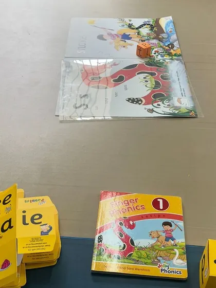 Our phonics program uses tools like flashcards and storybooks to teach letter sounds, helping children decode words logically.