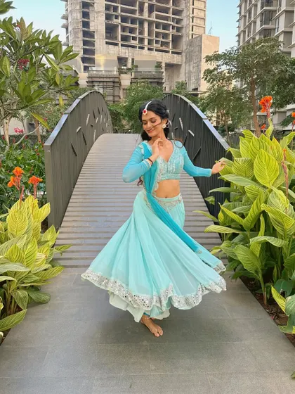 Every movement tells a story. Here, I'm using hand gestures, or mudras, which are a key part of the expressive language of Indian dance.