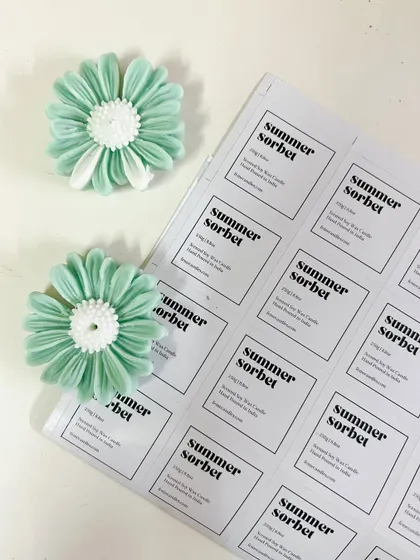 Studio days. Labeling our 'Summer Sorbet' candles and preparing the flower wax toppers.