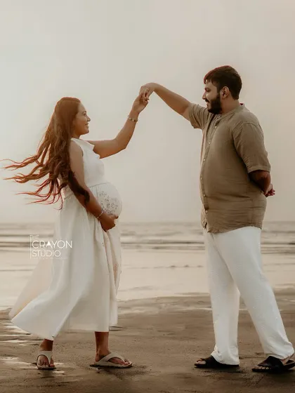 A playful dance on the sand. Outdoor sessions are perfect for capturing spontaneous, joyful interactions that show a couple's unique personality.