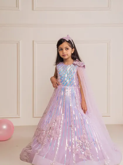 This lilac butterfly gown is straight out of a fairytale, with a sequined top, 3D butterflies, and a matching cape.
